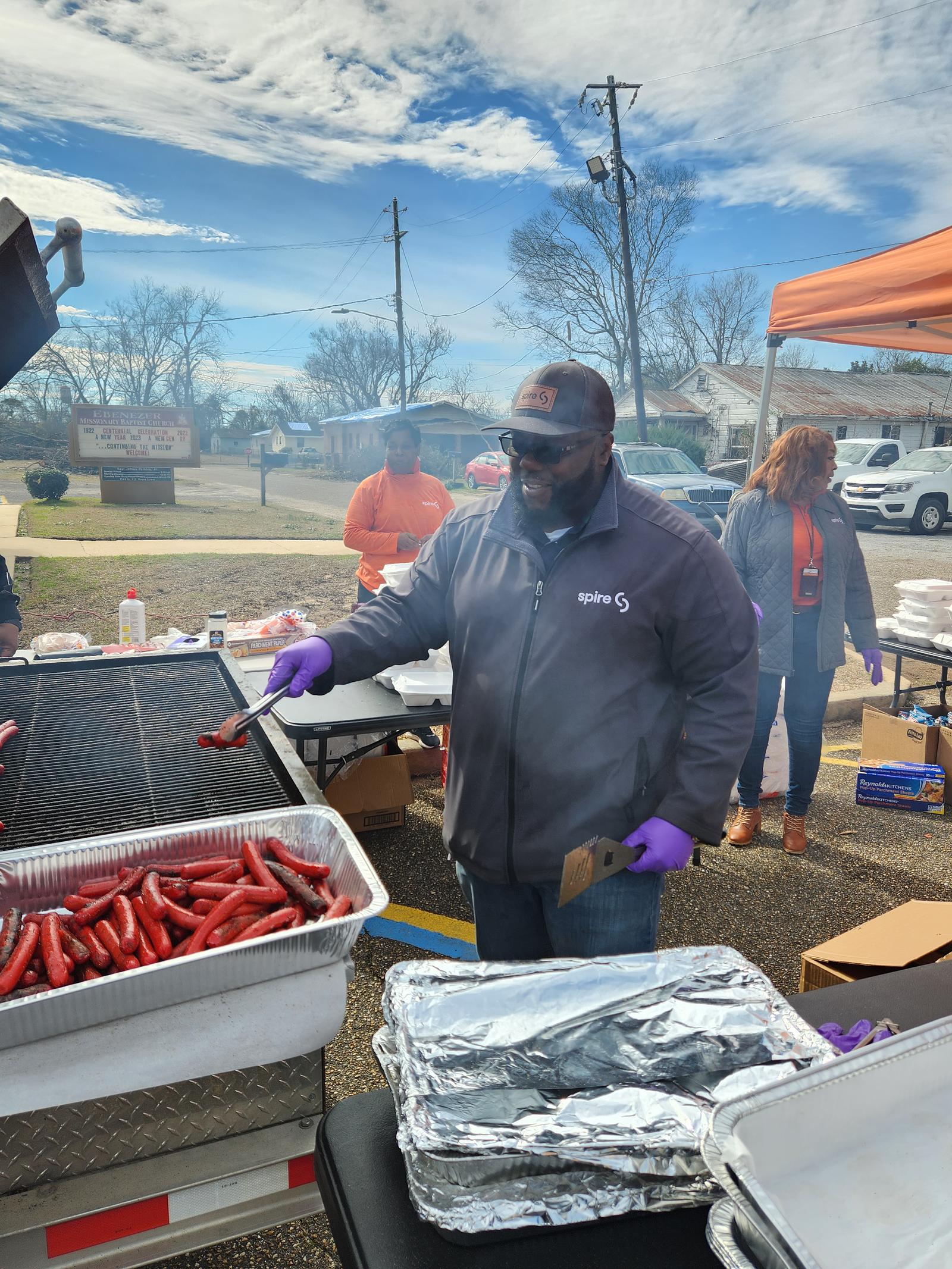 employee grilling at volunteer event in selma