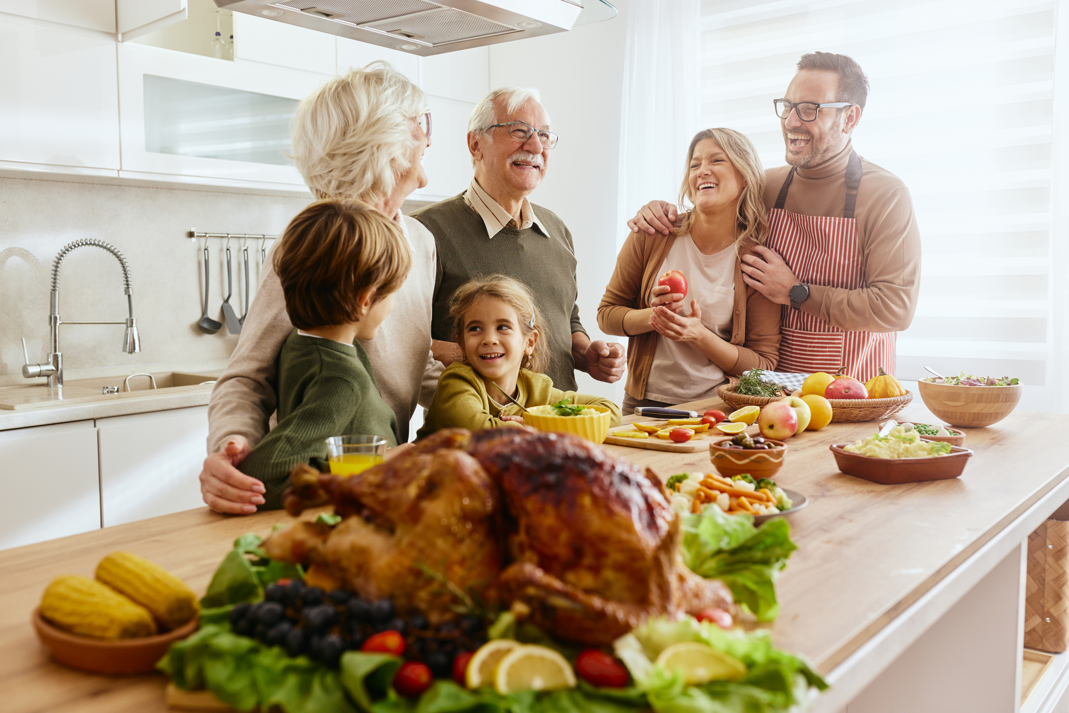 family in kitchen thanksgiving