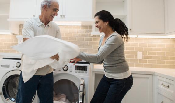 Husband and wife doing laundry