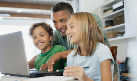 Family looking at computer