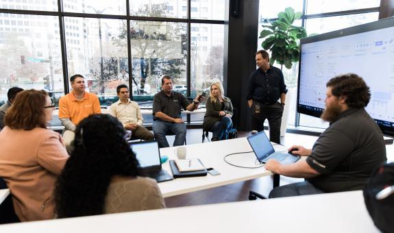 Image of Spire employees collaborating in office