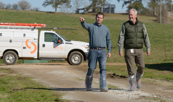 Two men speaking at farm in Rayburn Alabama