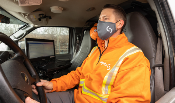 Spire employee wearing mask in truck
