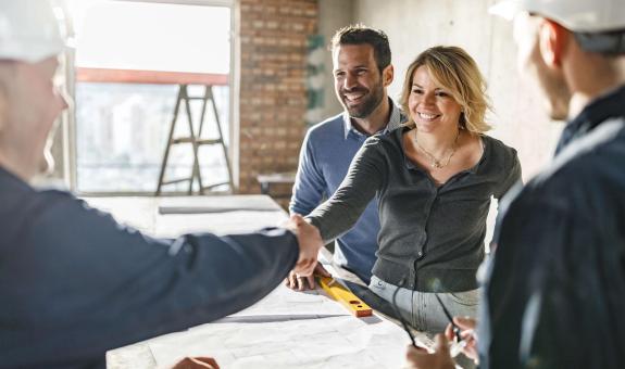 Image of a contractor speaking with a family