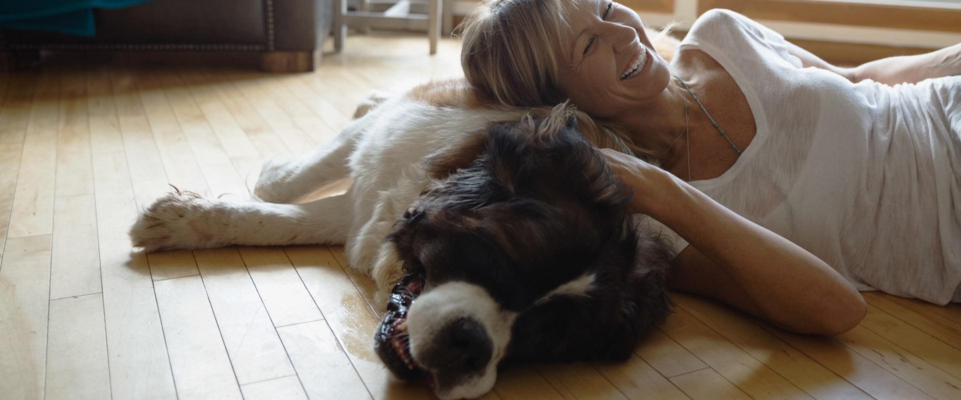 Woman and dog snuggling