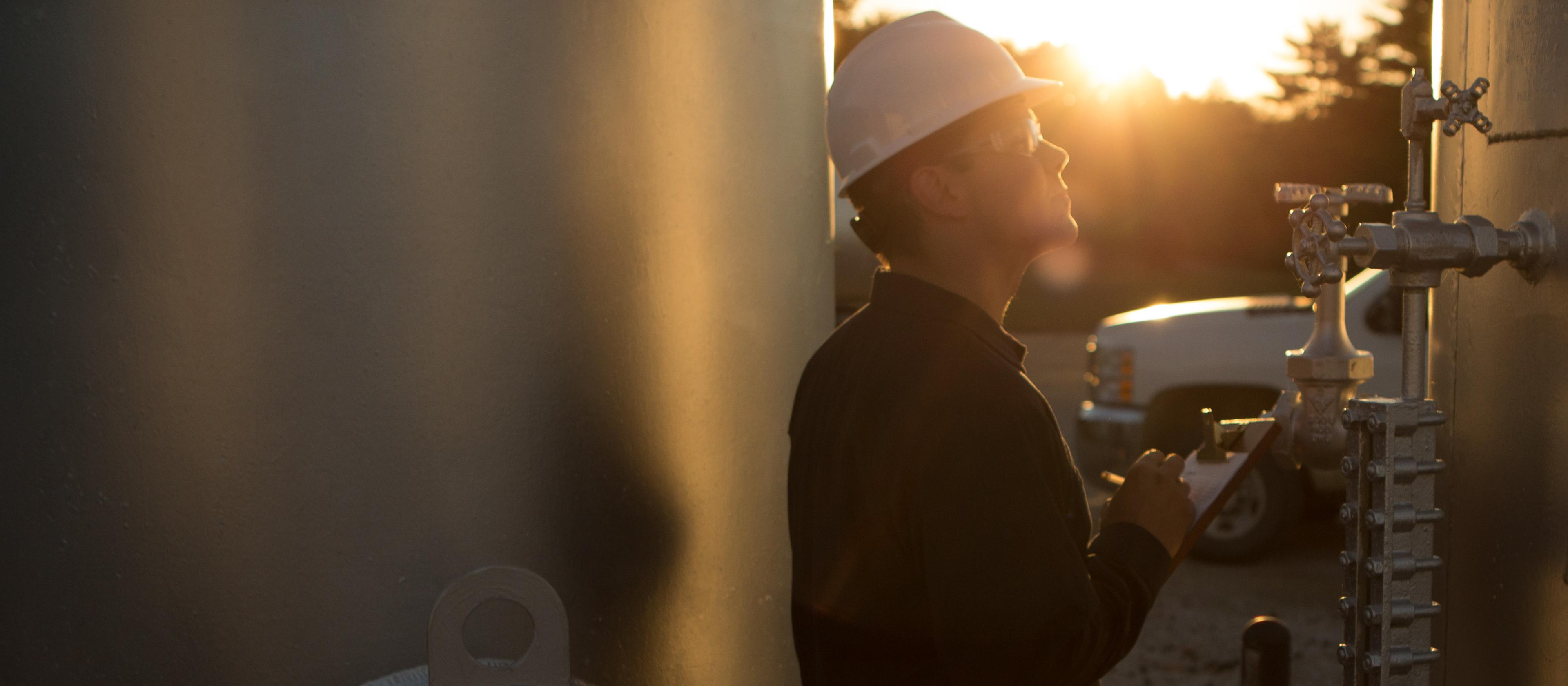 Man looking at gas equipment