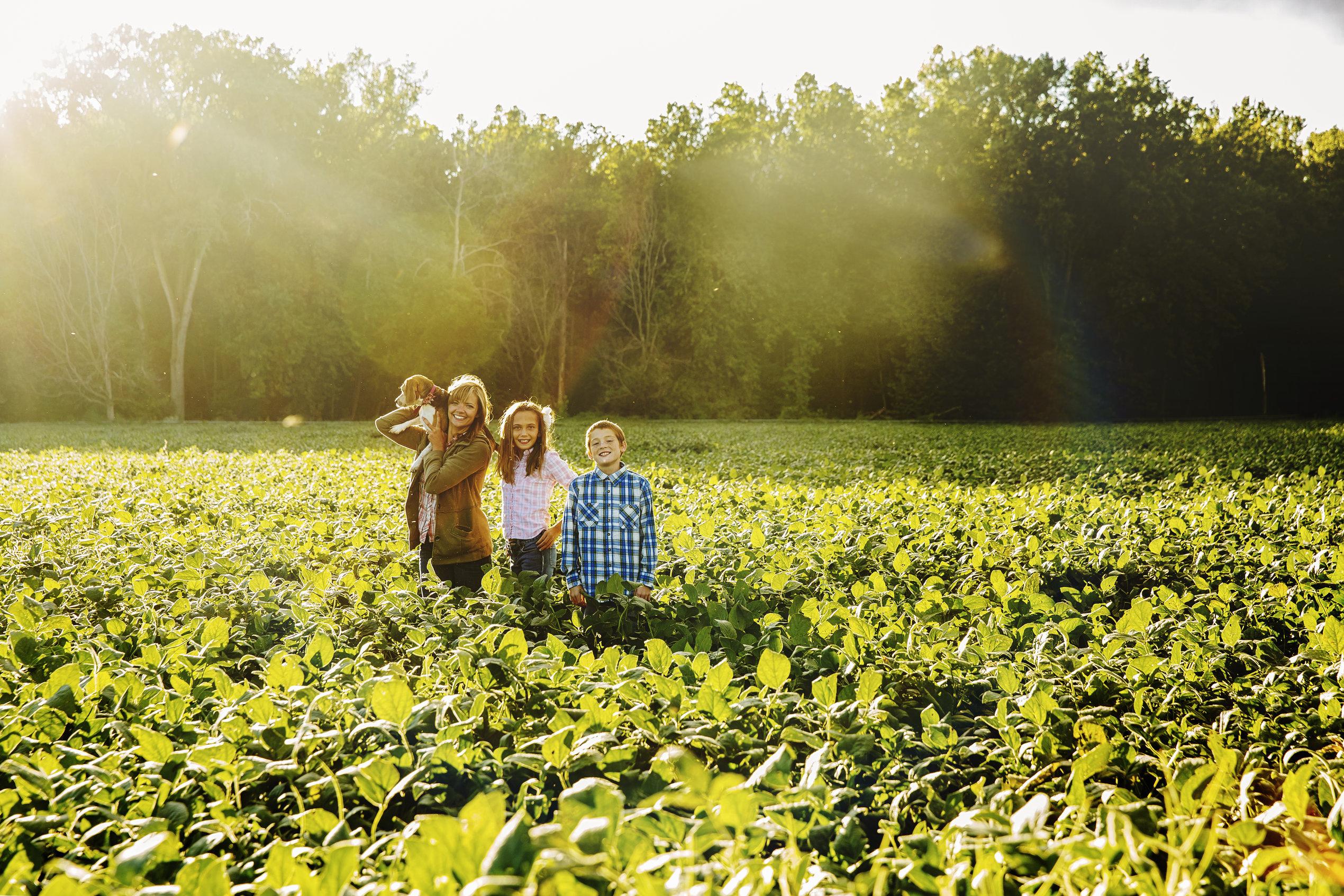 Family standing in field