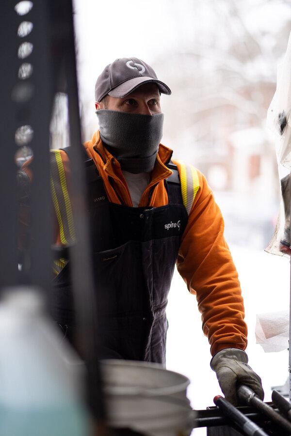 Image of: Spire employee working in snow