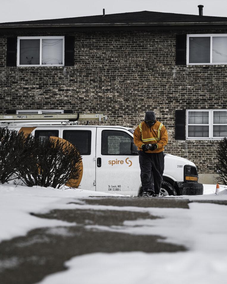 Image of: Spire employee working in snow