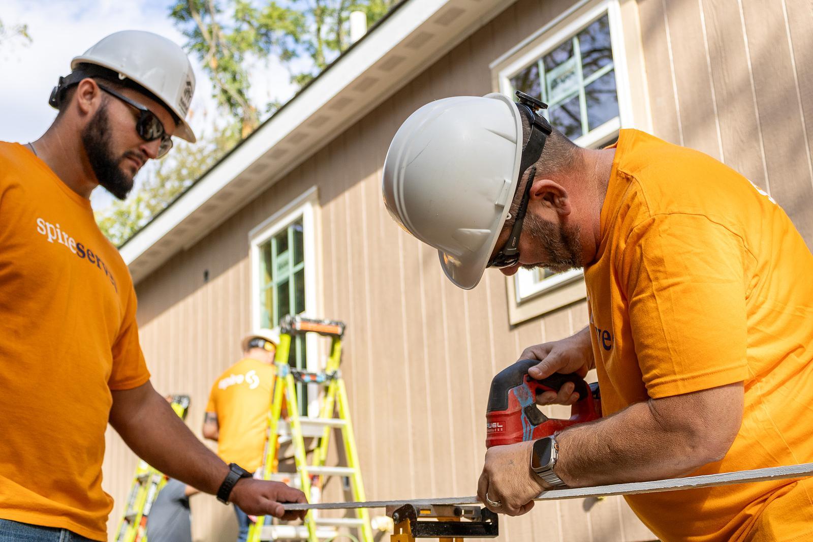 employees working on house framing