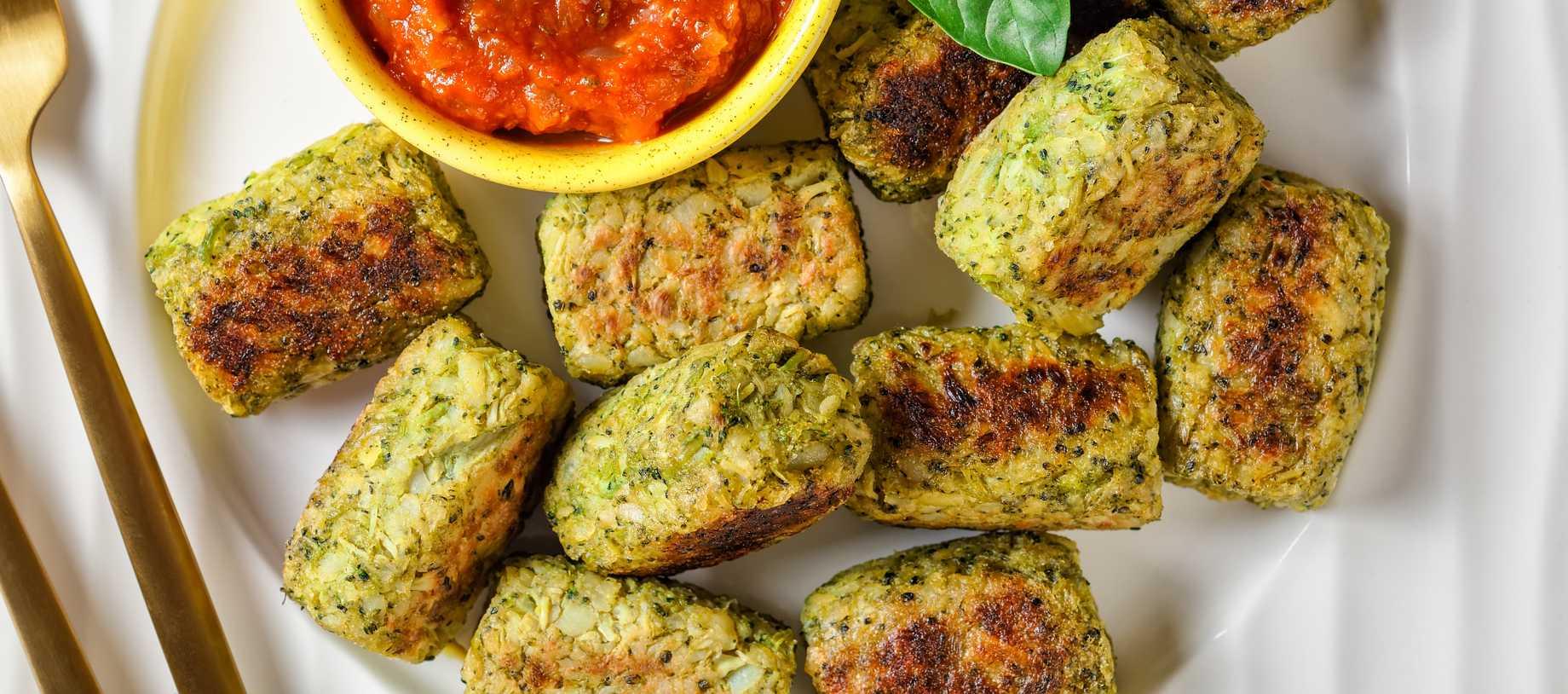 broccoli tots on a plate with sauce