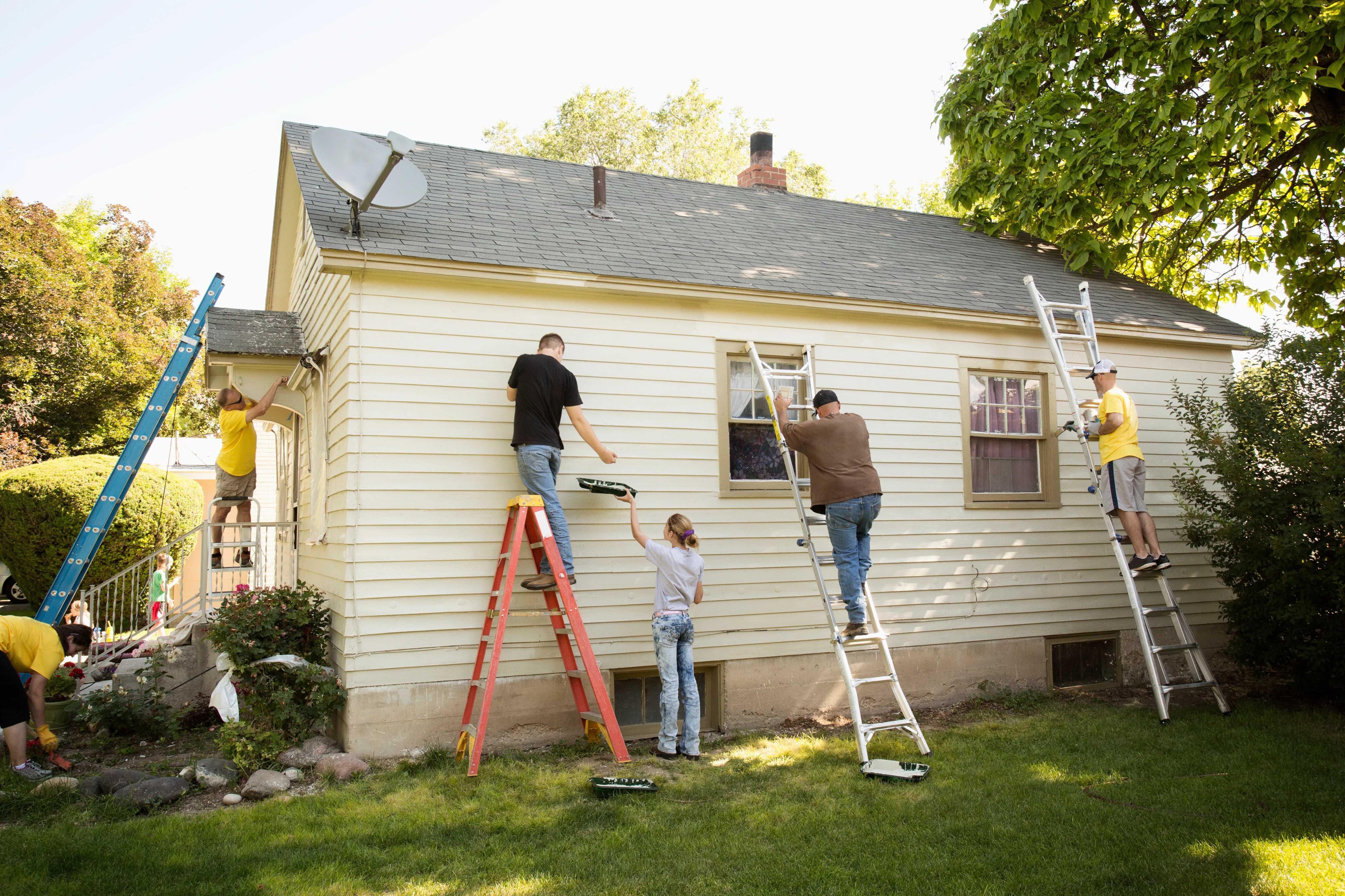 Image of family working on a house