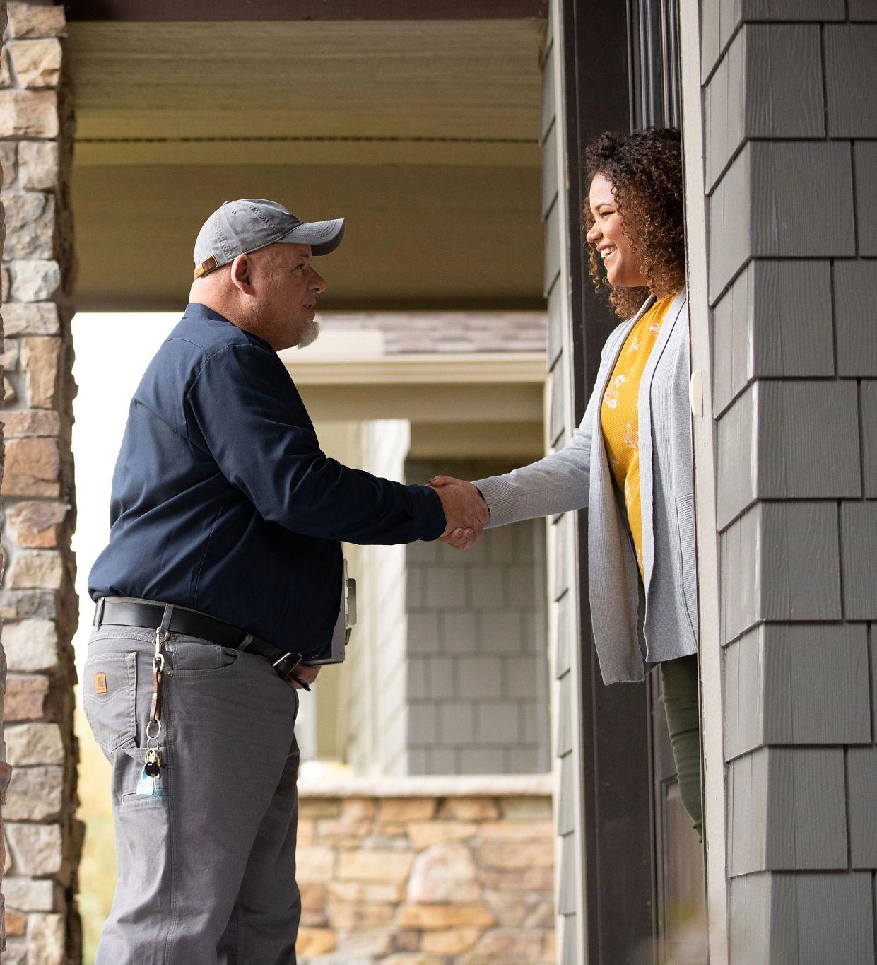 Image of contractor greeting customer