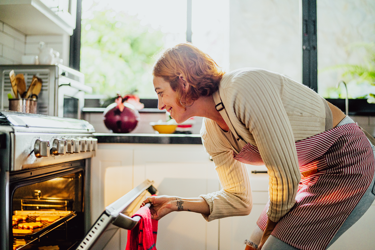Woman opens oven