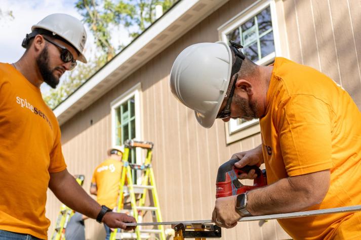 employees working on house framing